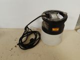 an image of a black and white blow dryer on a counter