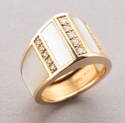 a close up of a gold ring with white and clear stones