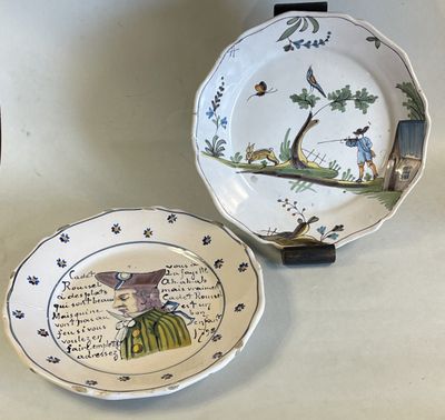 two plates with designs on them are sitting on a table