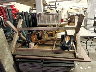 several pieces of wood are stacked on top of each other in a warehouse