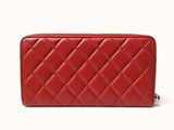 red quilted leather wallet with zipper closure and zipper closure