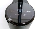 a black blender with a black handle on a white table