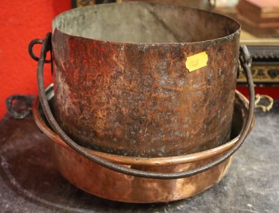 a large metal pot sitting on top of a table