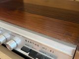 a radio sitting on top of a wooden shelf