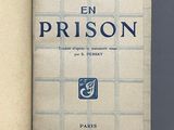 an open book with a picture of a prison on the cover