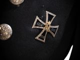an image of a coat with a cross on it