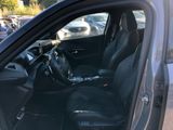 the interior of a car with the door open and the driver ' s seat up