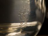 a close up of a glass of wine on a table