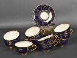 an image of a group of blue and gold cups and saucers