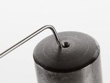 a metal object with a long metal handle on it
