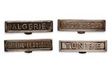 three antique cast iron nameplates with the names of different countries