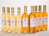 six bouteilles de vin blanc alignées