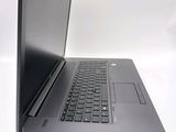 a laptop that is open on a white surface