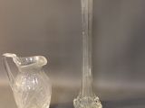 two vases and a soap dish sitting on a table