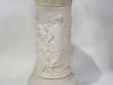 a white vase with a picture of a man and a woman on it