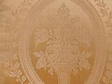 a chair that has a floral design on the back of it