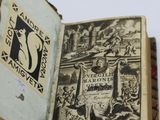 an old book with a picture of a city inside of it