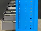 a blue metal cabinet with drawers and drawers on it
