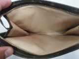 a person that is holding a wallet in their hand