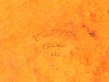 a close up of a piece of wood with writing on it