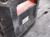 a close up of a piece of metal on the ground