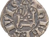 a close up of a coin with a face on it