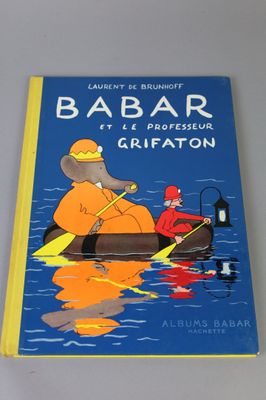 a blue book with a picture of a man in a boat