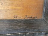 an image of a close up of a piece of wood with a signature on it