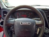 dashboard of a vehicle with a steering wheel and a dash light