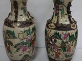 two vases that are sitting next to each other on a table