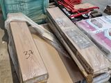a lot of boxes and boxes of wood on the floor