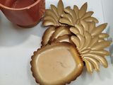 a cup and a cookie sitting on a table