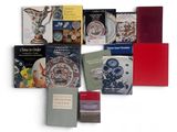 a lot of books that are sitting on a table