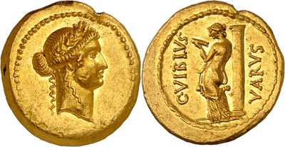 a gold coin with an image of a woman holding a sword