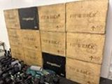 a pile of luggage sitting on the floor in front of a wall