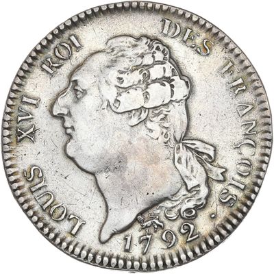 une pièce d'argent portant une tête de femme