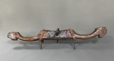a sculpture of a camel with a saddle on it ' s back