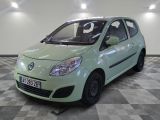 a picture of a small green car parked in a garage