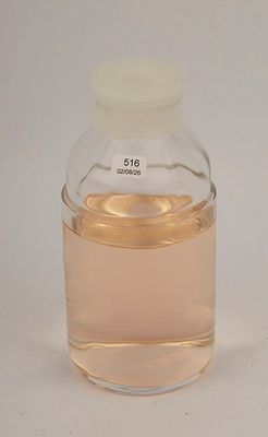 a bottle of liquid sitting on a table with a white background
