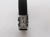 a close up of a watch on a white surface with a white background