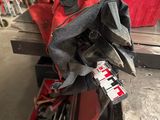 a pile of tools sitting on top of a wooden table
