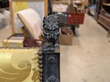 an image of a chair in a store with a lion head on the back