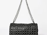 a close up of a black purse on a white background