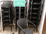 a lot of chairs and a sign in a room