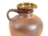 a brown vase with a brown handle on a white background