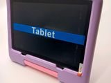 a purple tablet with a blue stripe on the screen