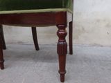 a green chair with a green cushion on it