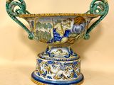 a blue and white vase with a design on it
