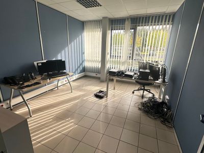 a room with a lot of computers on the desk