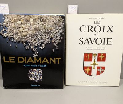two books sitting on top of a table next to each other